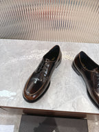 Lace-up leather shoes by Prada, dark brown Oxford style with black laces and wing seam