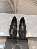 Unisex black leather loafers with Prada triangular logo on front