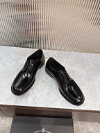 Prada unisex lace-up dress shoes, glossy black leather, low-profile sole.
