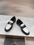 Prada unisex loafers, black leather slip-on with white strap and gold emblem