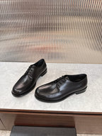 Black lace-up leather shoes with low heel, side view on display