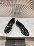 Prada unisex loafers, black leather, side angle pair with glossy finish