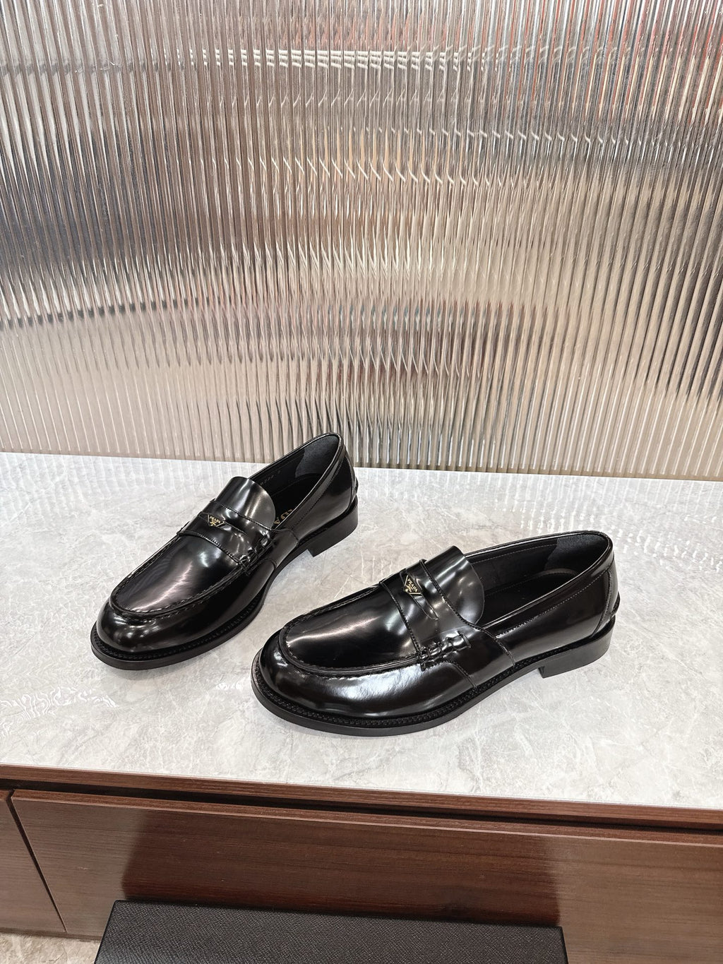 Prada unisex loafers, black leather, front and side view