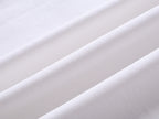 White T-shirt fabric close-up with fine knit texture