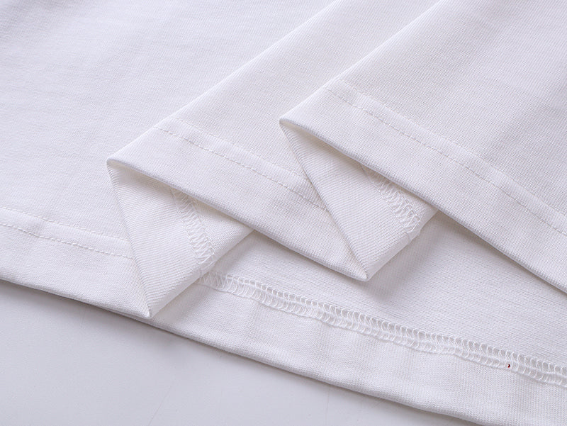 White T-shirt hem and side seam with stitched fold detail
