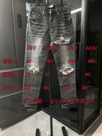 Distressed gray denim jeans with rips at knees and frayed edges