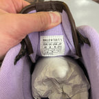 Brown sneaker interior label reading Balenciaga and size 42.