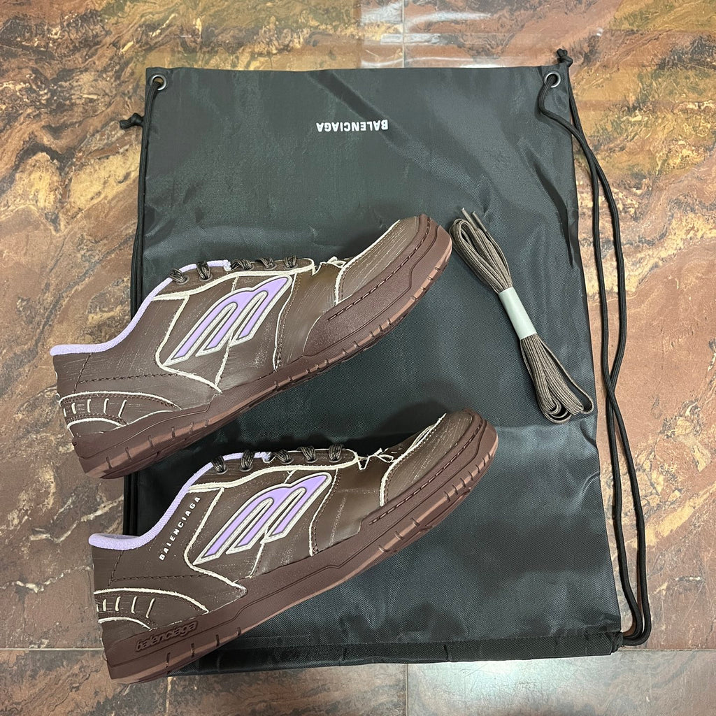 Brown Balenciaga sneakers with purple logo, textured sole, low-top design
