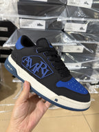 Low-top sneakers with black-and-blue color block, lace-up front and side logo