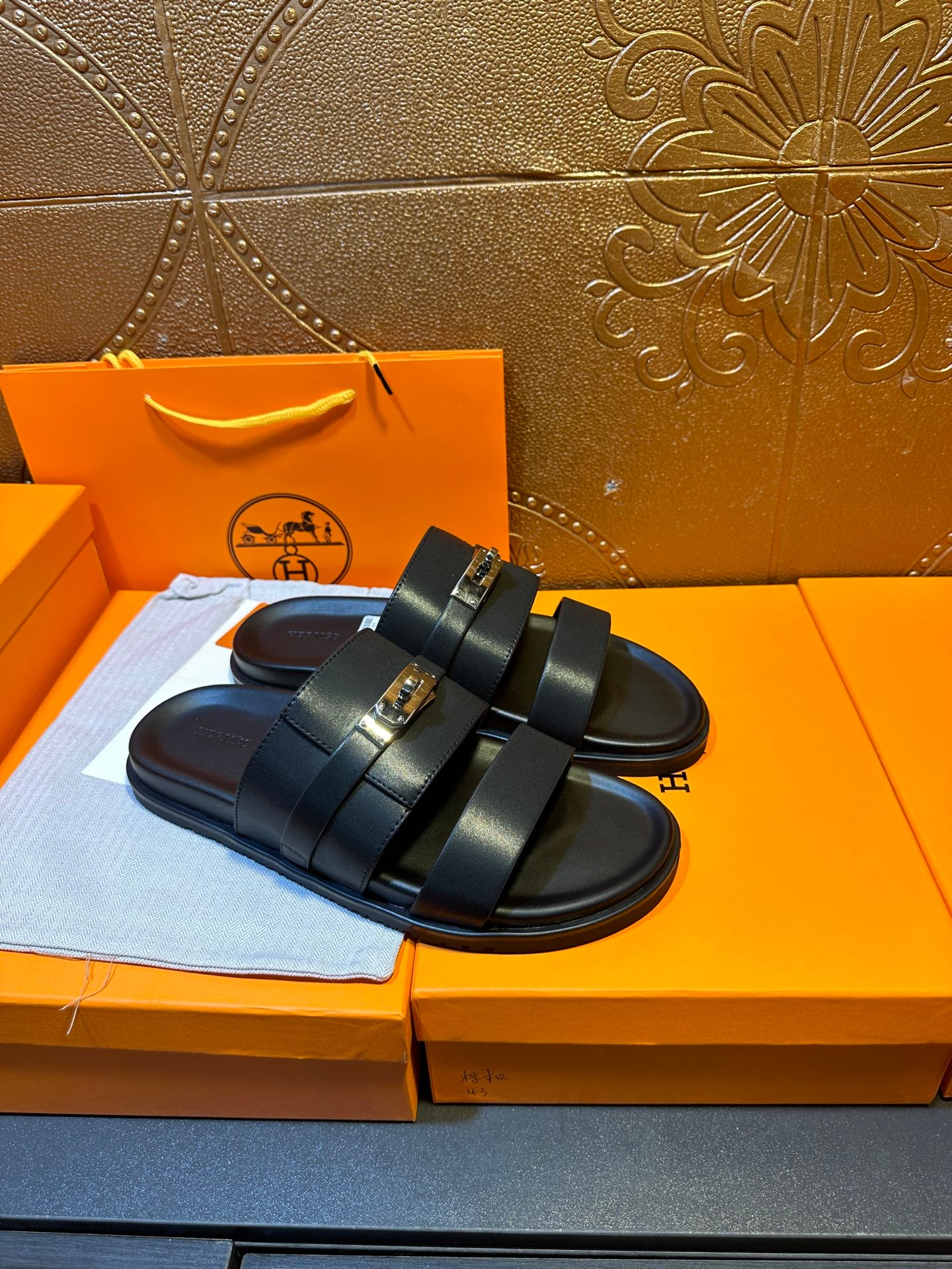 Hermes leather slide sandals, dark navy, with two wide straps and rectangular buckle