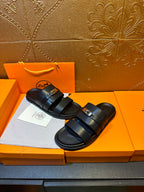 Hermes leather slide sandals, dark navy, with double straps and square gold buckle