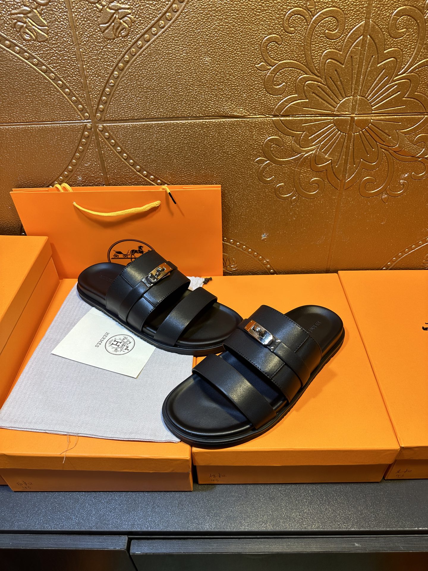Hermes leather slide sandals, dark navy, with double straps and square gold buckle