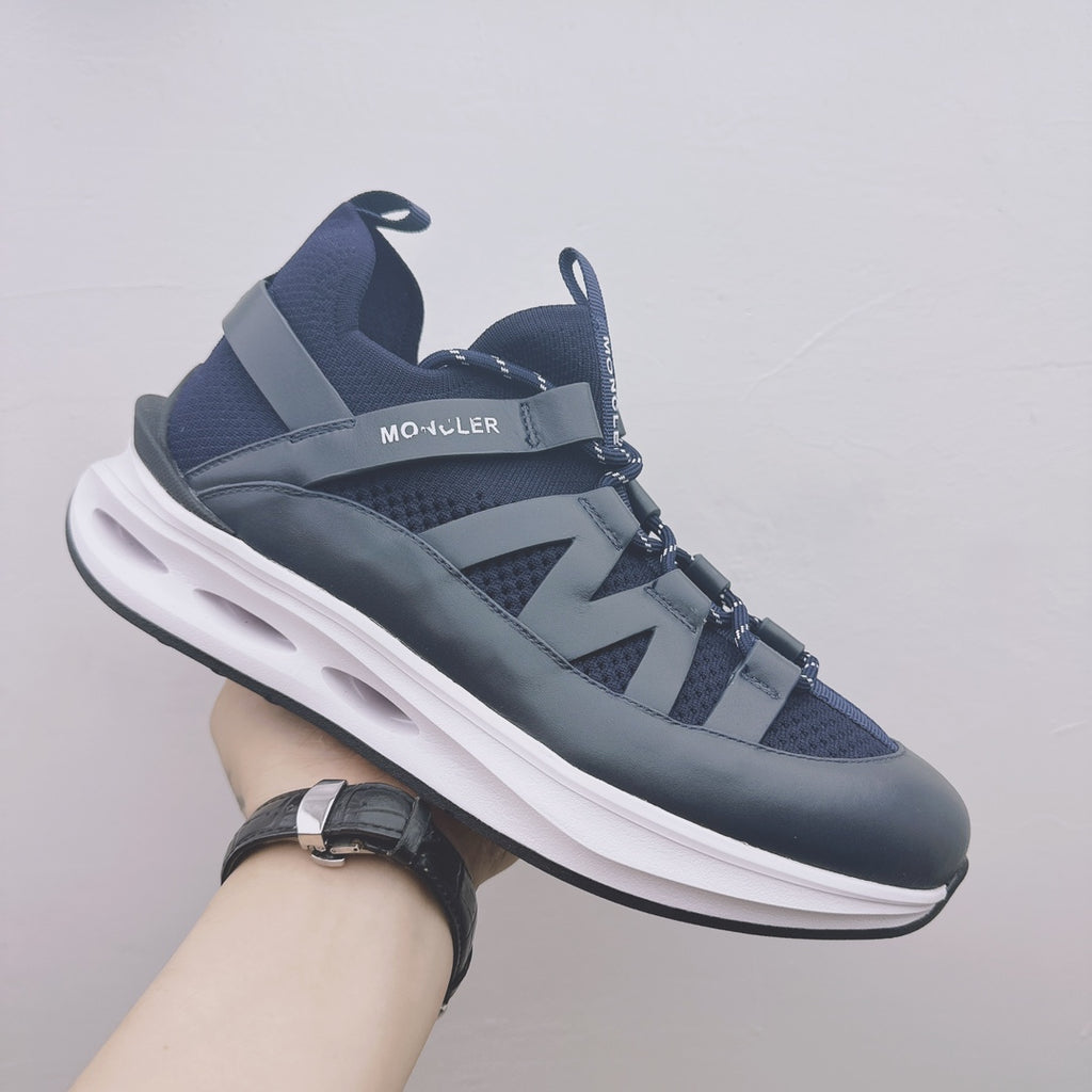 Moncler lace-up sneaker in dark blue with white midsole, side logo panel