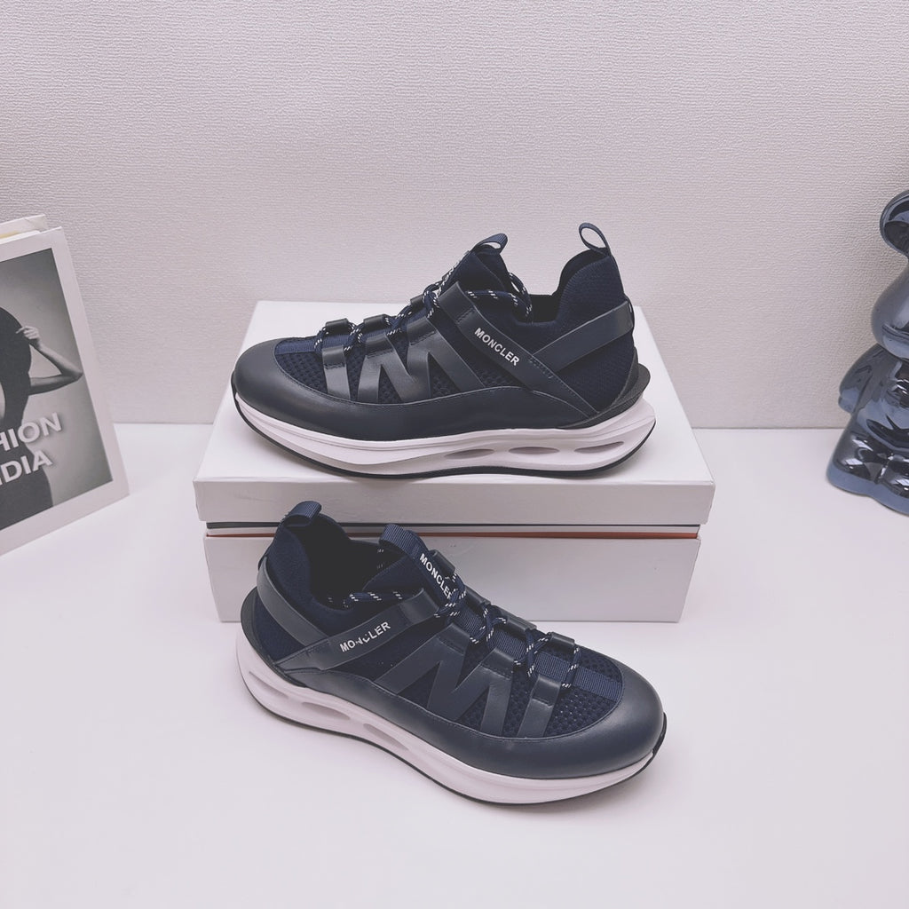 Moncler lace-up sneakers in dark blue with textured straps and chunky white sole