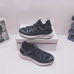 Moncler lace-up sneakers in dark blue with textured straps and chunky white sole