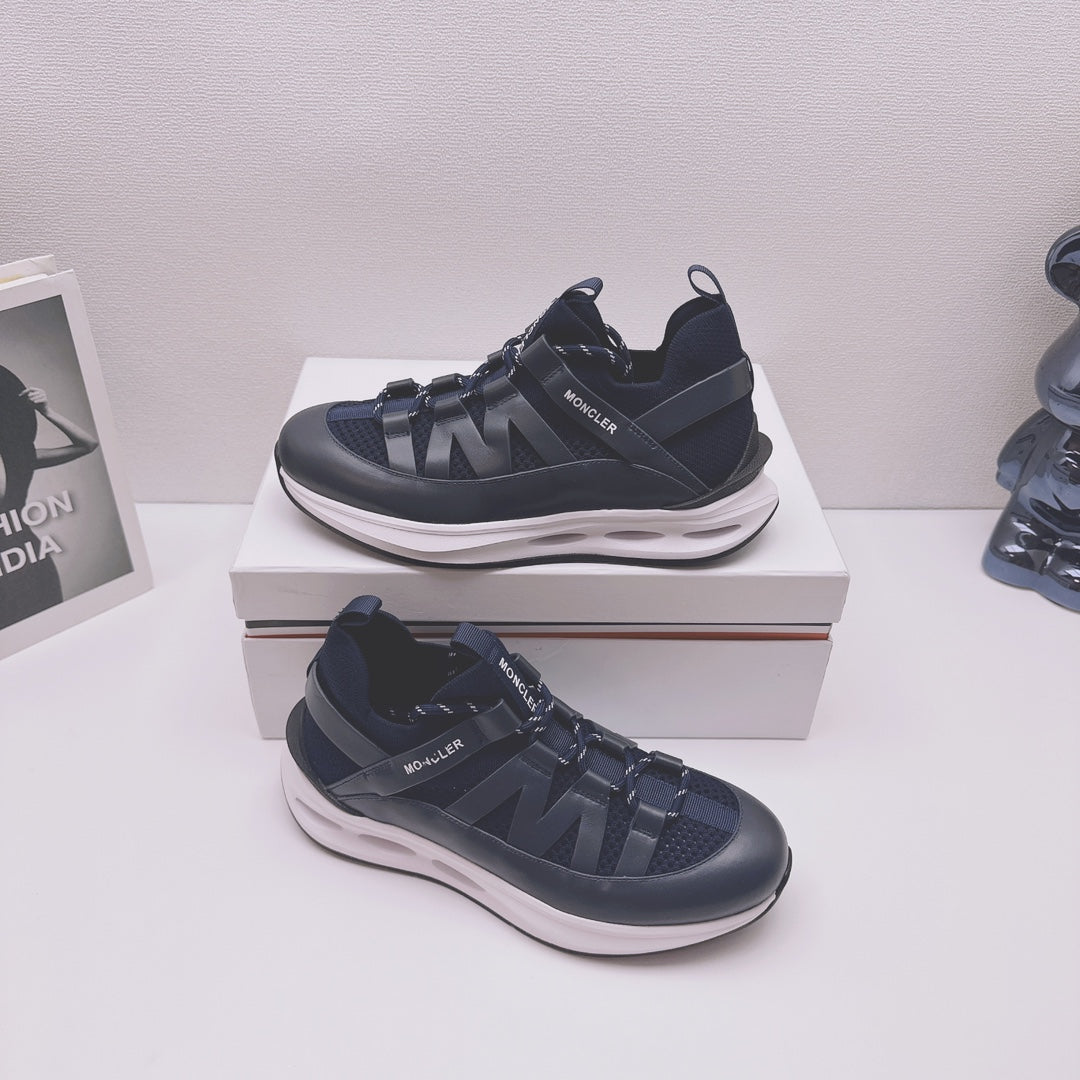 Moncler lace-up sneakers in dark blue with textured straps and chunky white sole