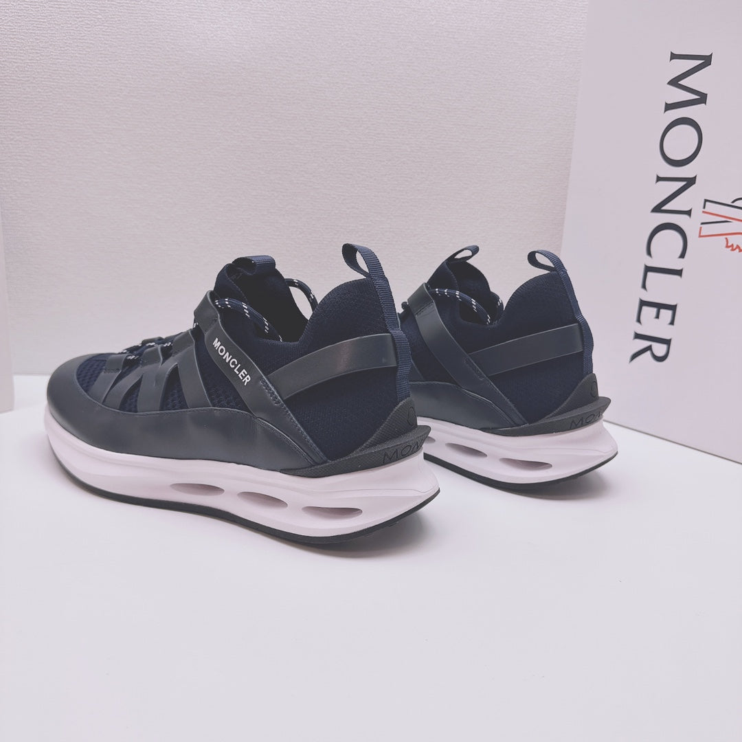 Moncler low-top sneakers in dark blue, side view pair with white outsole