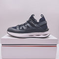 Moncler lace-up sneaker in dark blue with cutout logo and chunky white midsole