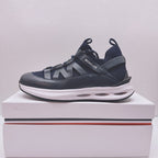 Moncler lace-up sneaker in dark blue with cutout logo and chunky white midsole