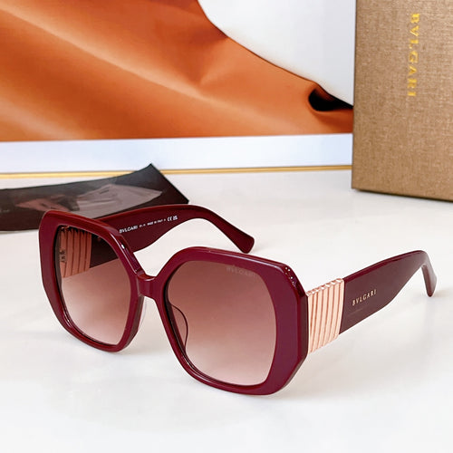 Bvlgari sunglasses with red frames and tinted brown lenses