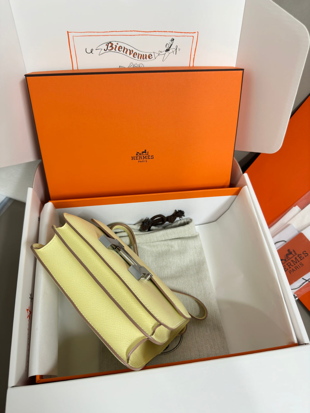 Hermes mini bag with strap in light lime yellow, with dust bag in box