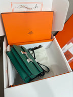Green leather mini handbag with crossbody strap and silver H hardware, in box