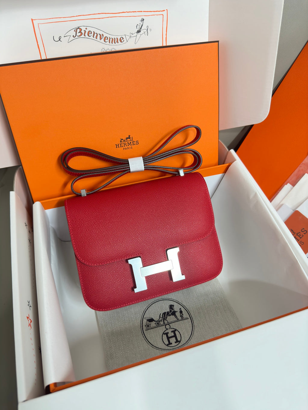 Hermes red leather crossbody bag with gold H clasp