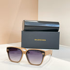 Square sunglasses with light tan frames and purple-tinted lenses