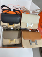 Hermes small crossbody bags set with black, cream, taupe, and tan H logo hardware
