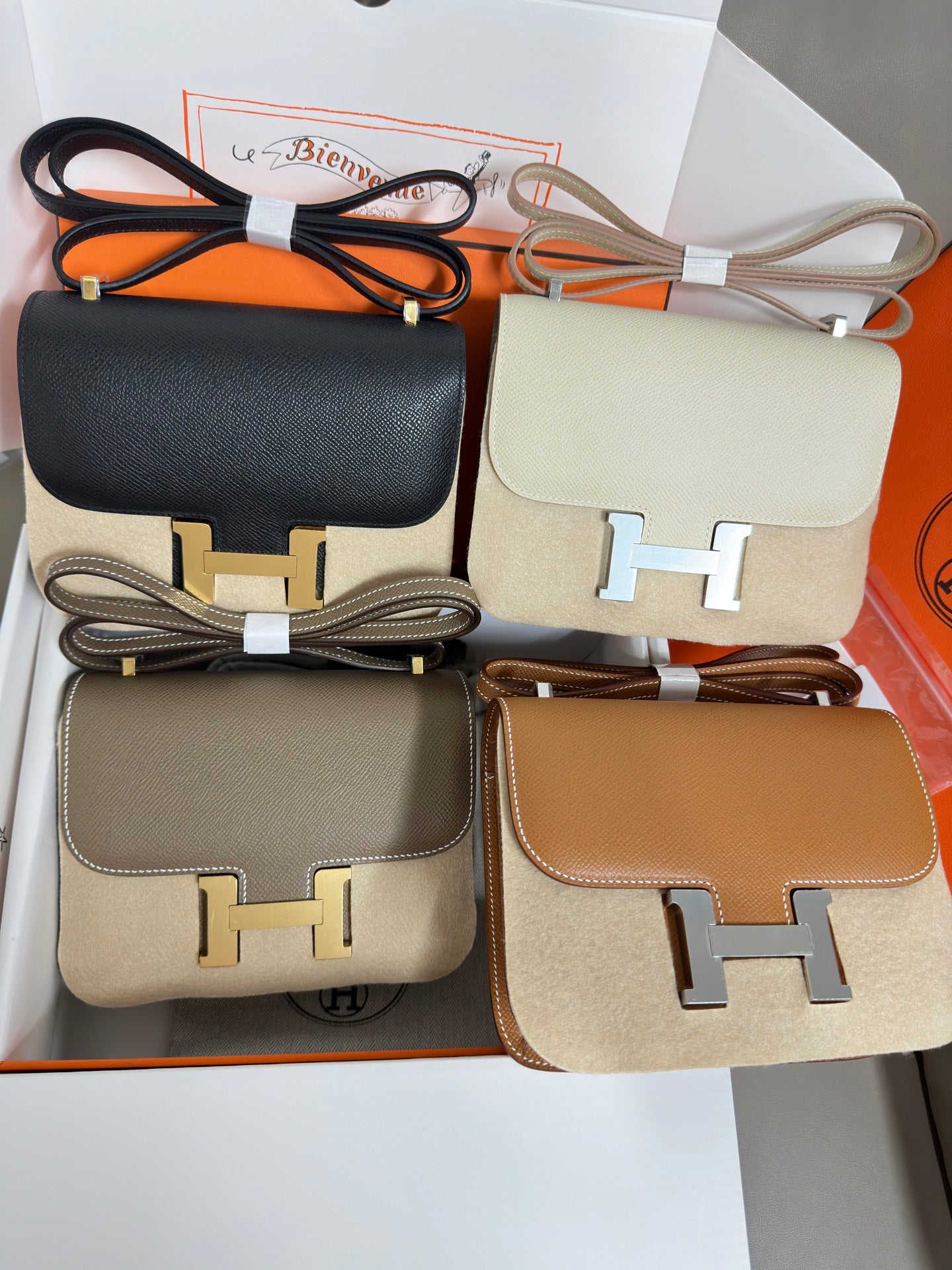 Hermes small crossbody bags set with black, cream, taupe, and tan H logo hardware