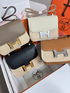 Hermes crossbody bags close-up: taupe, cream, black, and tan flap bags with H clasps