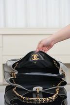 Chanel quilted handbag with chain strap, black interior view and gold hardware