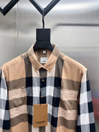 Long-sleeve button-up shirt with beige, navy and white plaid; pointed collar