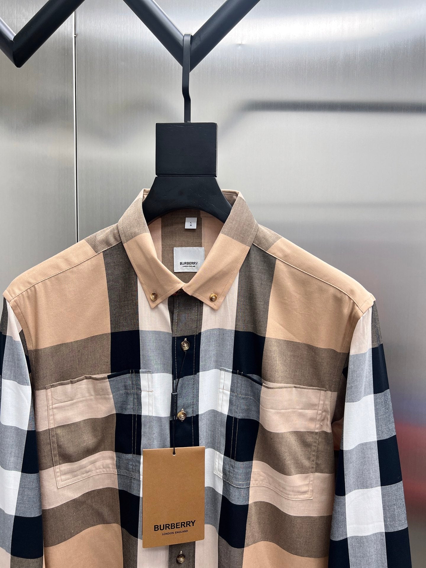 Long-sleeve button-up shirt with beige, navy and white plaid; pointed collar