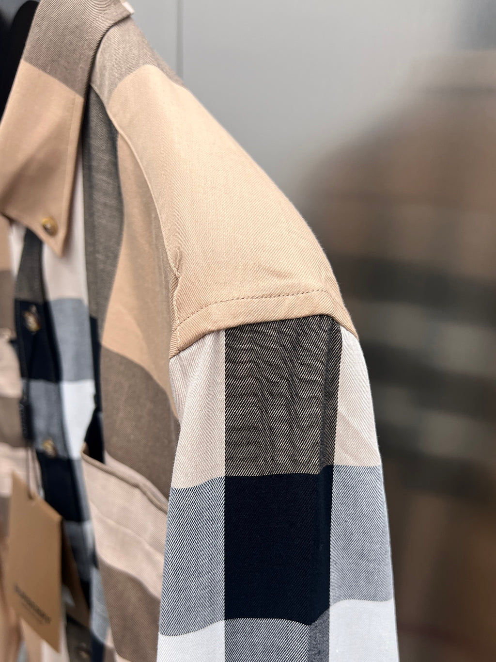 Long-sleeve button-up shirt sleeve and cuff in beige, navy, white plaid