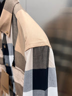 Long-sleeve button-up shirt sleeve and cuff in beige, navy, white plaid
