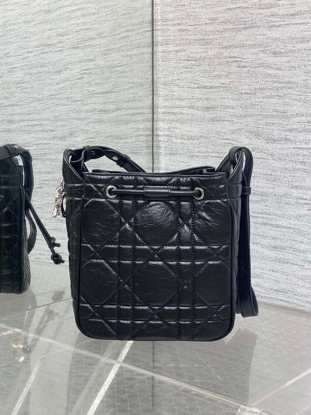 Dior black quilted leather crossbody bag with top handle and adjustable strap