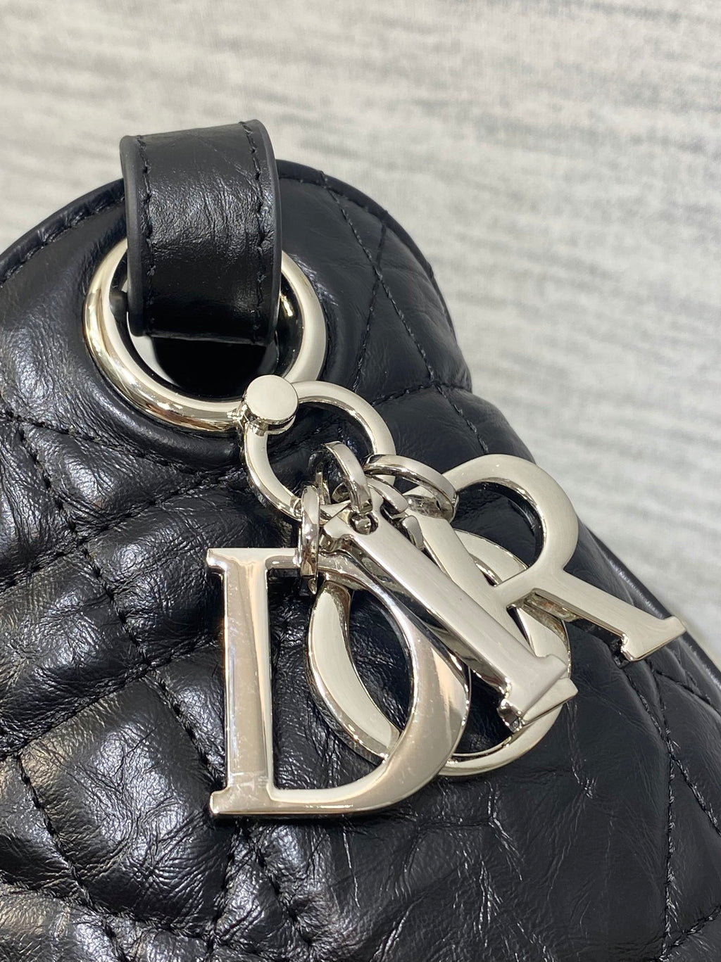 Dior black quilted leather bag with silver-tone Dior charm and ring hardware