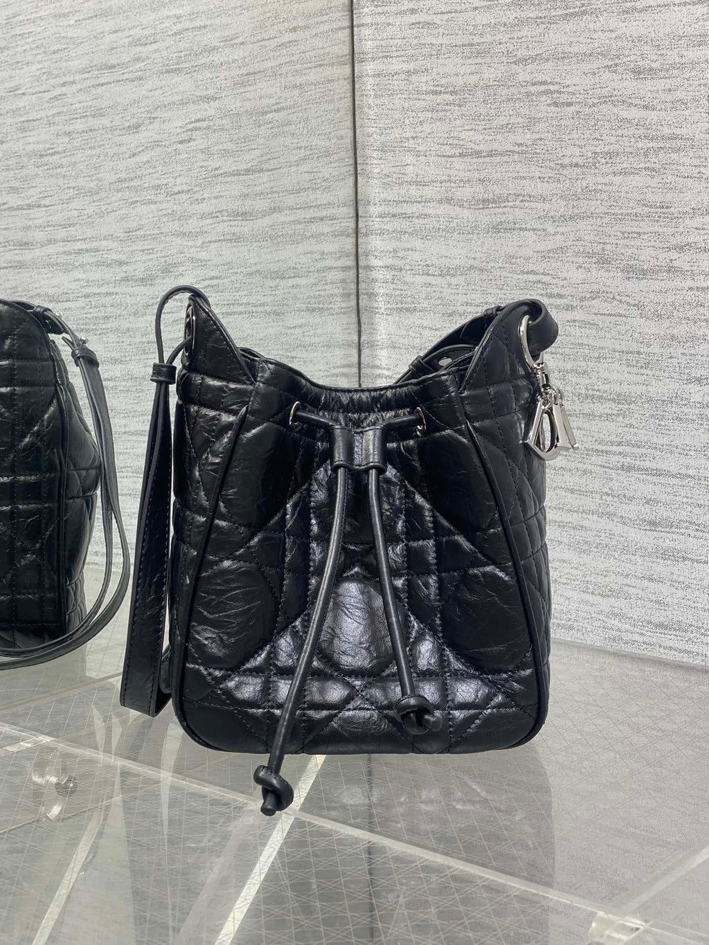Dior black quilted leather crossbody bag with drawstring-style top closure