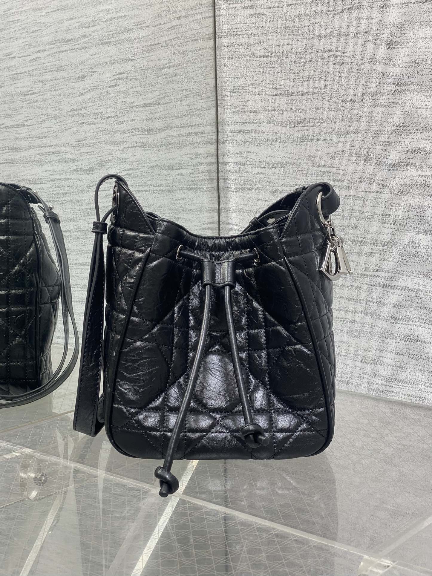 Dior black quilted leather crossbody bag with drawstring-style top closure
