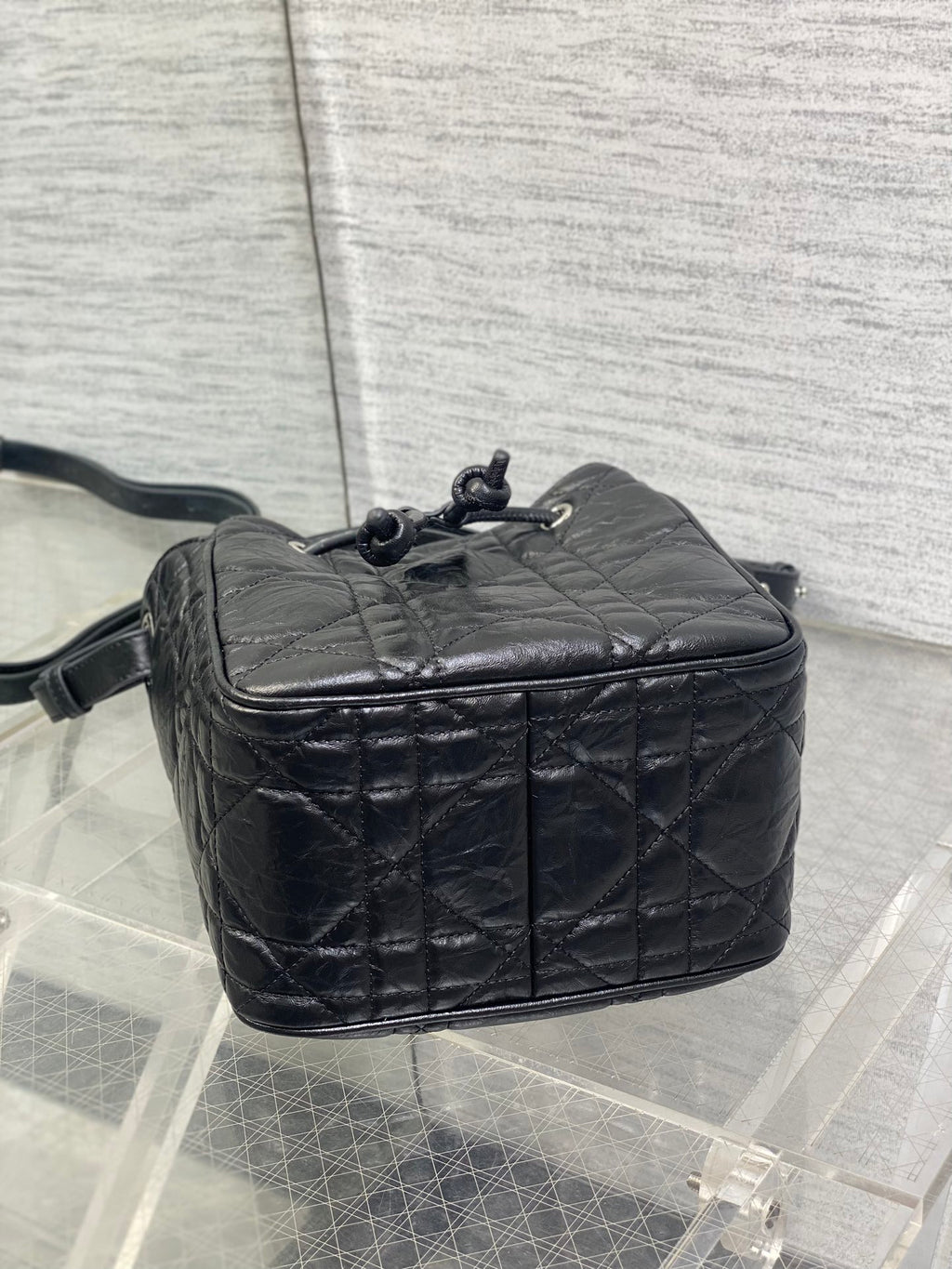 Dior black quilted leather crossbody bag with back panel and drawstring pull