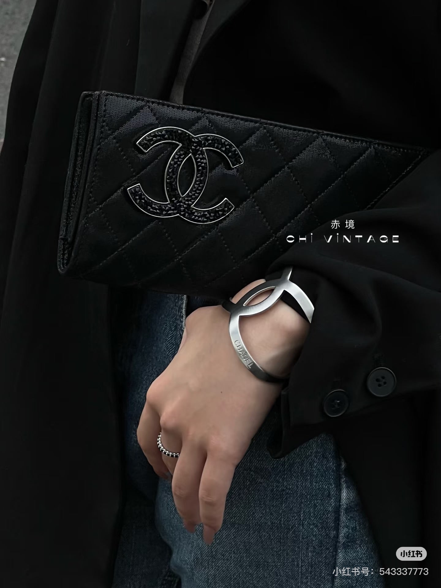 Chanel black quilted clutch with embossed CC logo and chain clasp