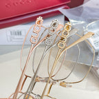 Gucci eyeglass frames set with gold, rose-gold, and silver-tone metal rims.