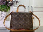 Monogram tote bag with tan leather handles and long shoulder strap, front view