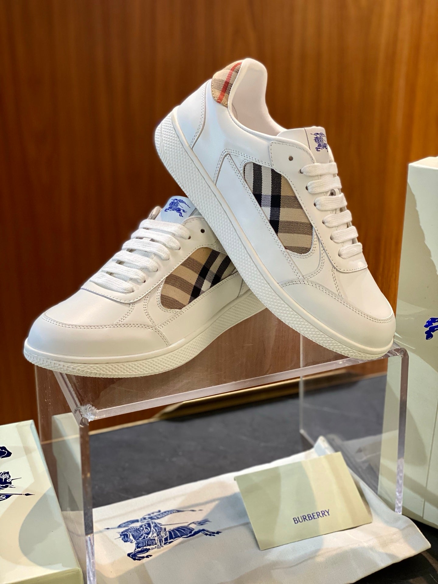 White low-top sneakers with multicolor check side panel and lace-up front
