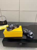 Fendi slide sandals, black floral print strap and textured footbed.