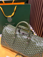 Goyard duffel bag in sage-green Goyardine with rolled handles and two front strap details