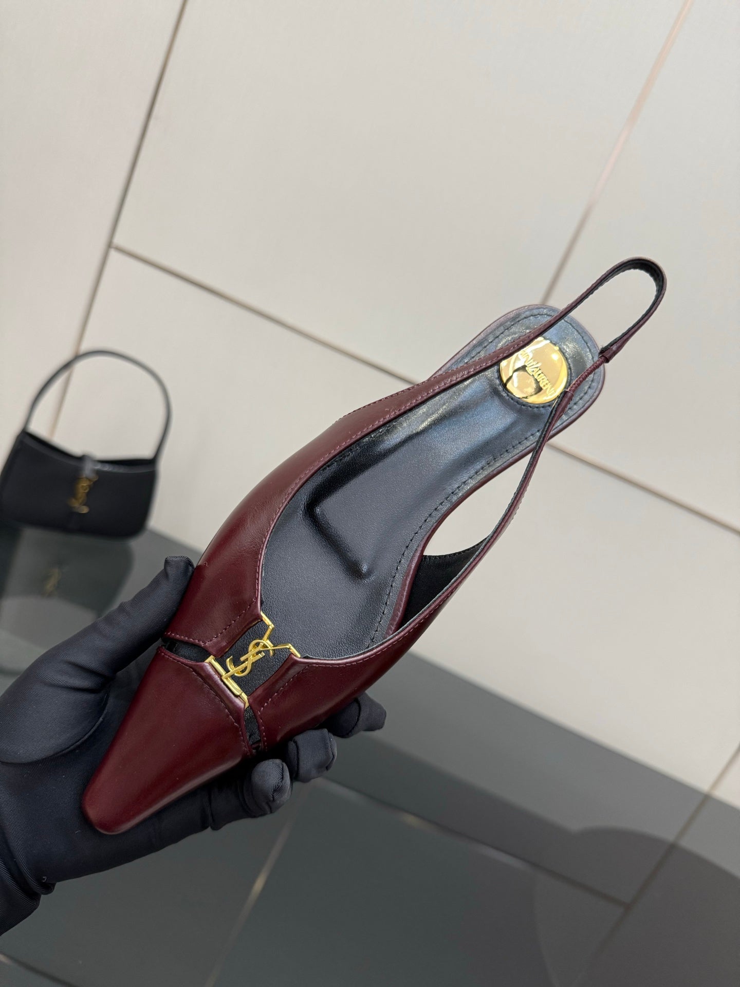 Women's YSL slingback flat, burgundy upper with gold buckle and slingback strap