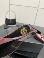 Women's YSL slingback flat, burgundy strap with gold emblem medallion detail