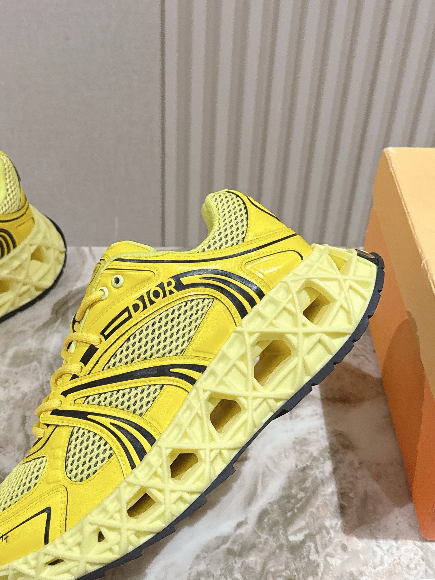 Dior unisex bright yellow sneakers with patterned sole and side logo detail